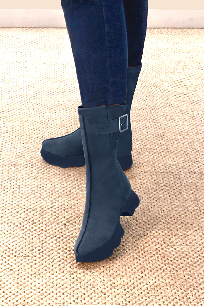 Denim blue women's ankle boots with a zip on the inside. Round toe. Low rubber soles. Worn view - Florence KOOIJMAN